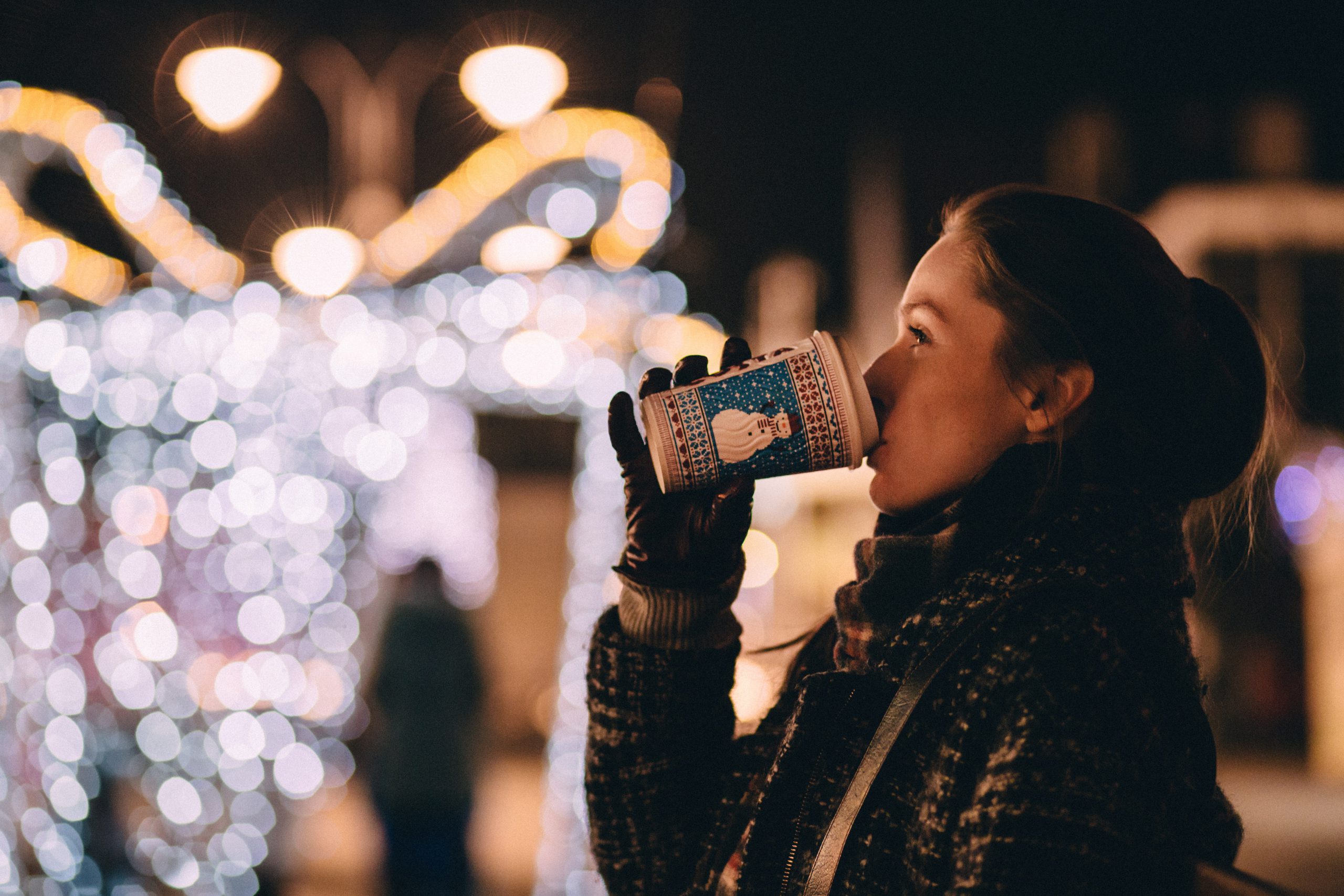 a woman drinking coffee during the holidays 