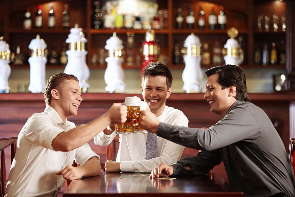 anaheimlighthouse-do-people-actually-tell-the-truth-when-drunk-article-photo-young-business-men-in-a-bar-with-beer-61772737
