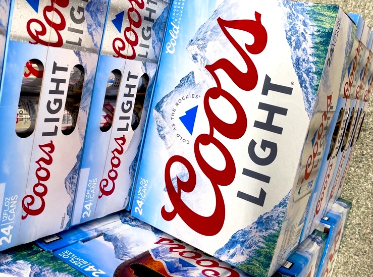 Boxes of Coors Light beer on a supermarket floor
