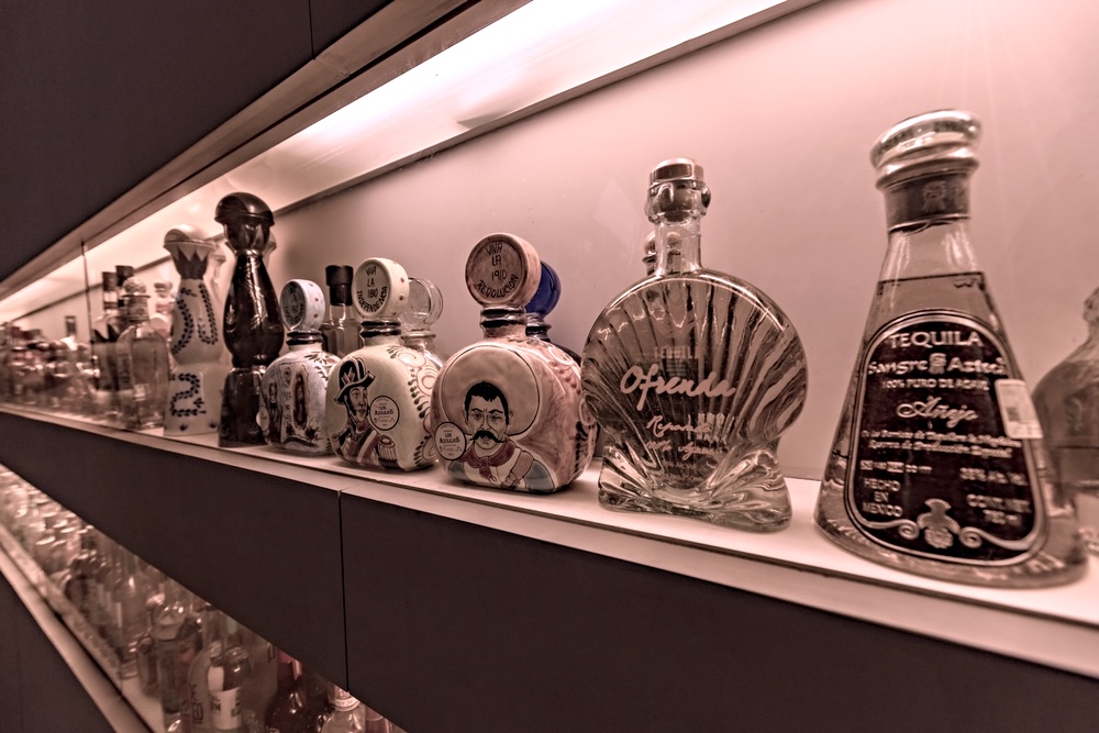 Bottles of tequila on a bar shelf 