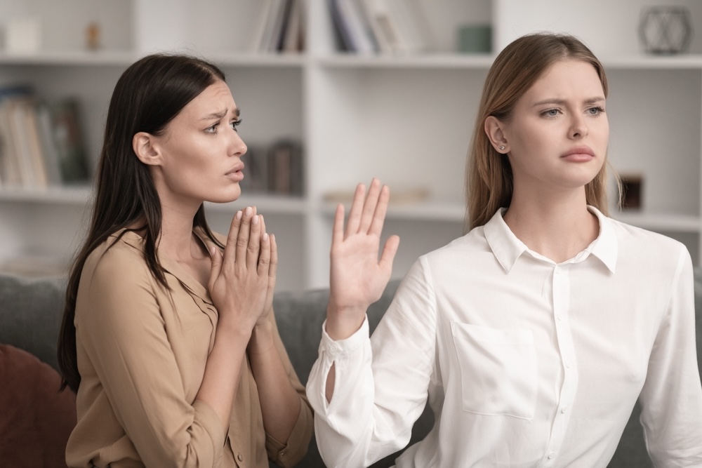 Female saying no to another female friend