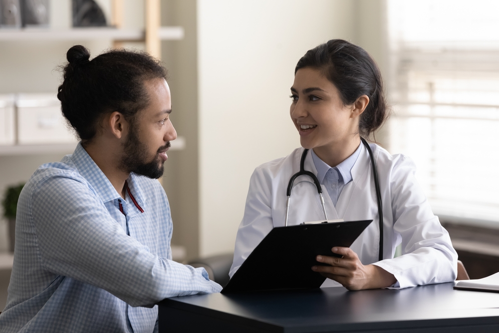 Man consulting with an addiction specialist about his detox options in professional rehab