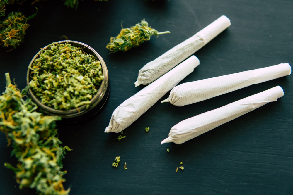 Rolled cannabis joint on a table 