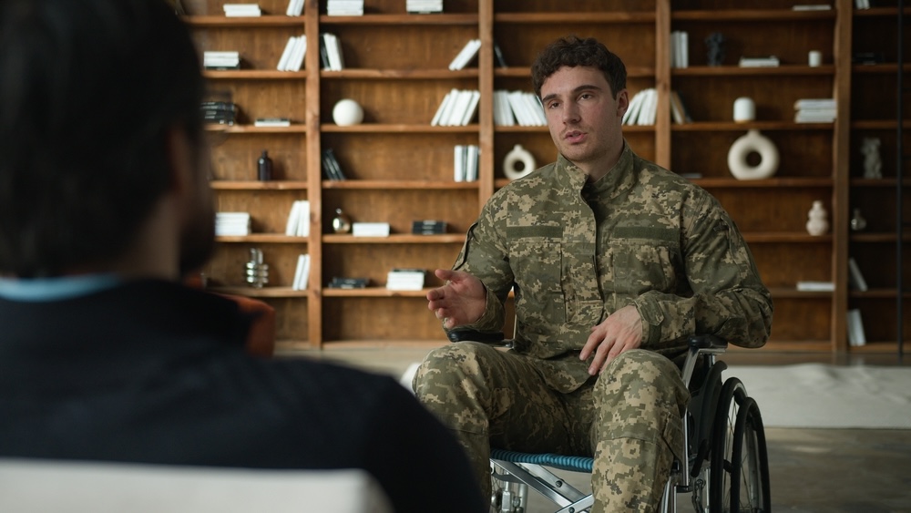 Male veteran talking with an addiction specialist